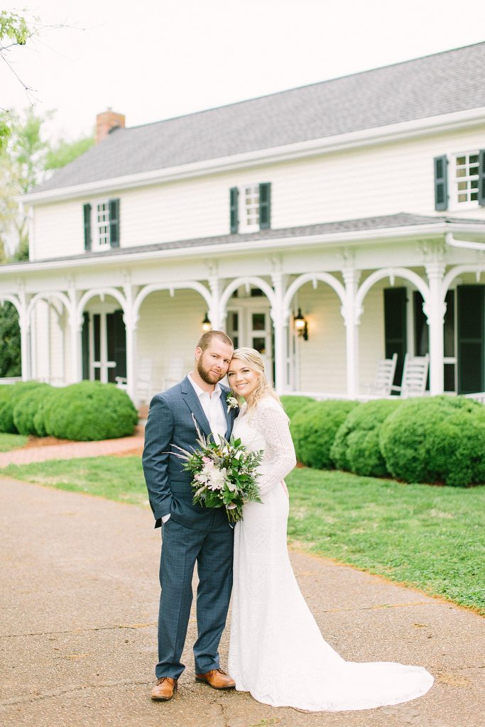 Classic bride and groom photo in front of Cool Springs House in Brentwood, Tennessee. 