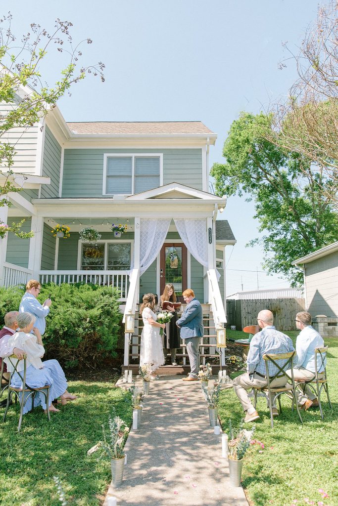 Intimate elopement wedding day in Nashville, Tennessee. Ceremony preformed in front yard with close family. 