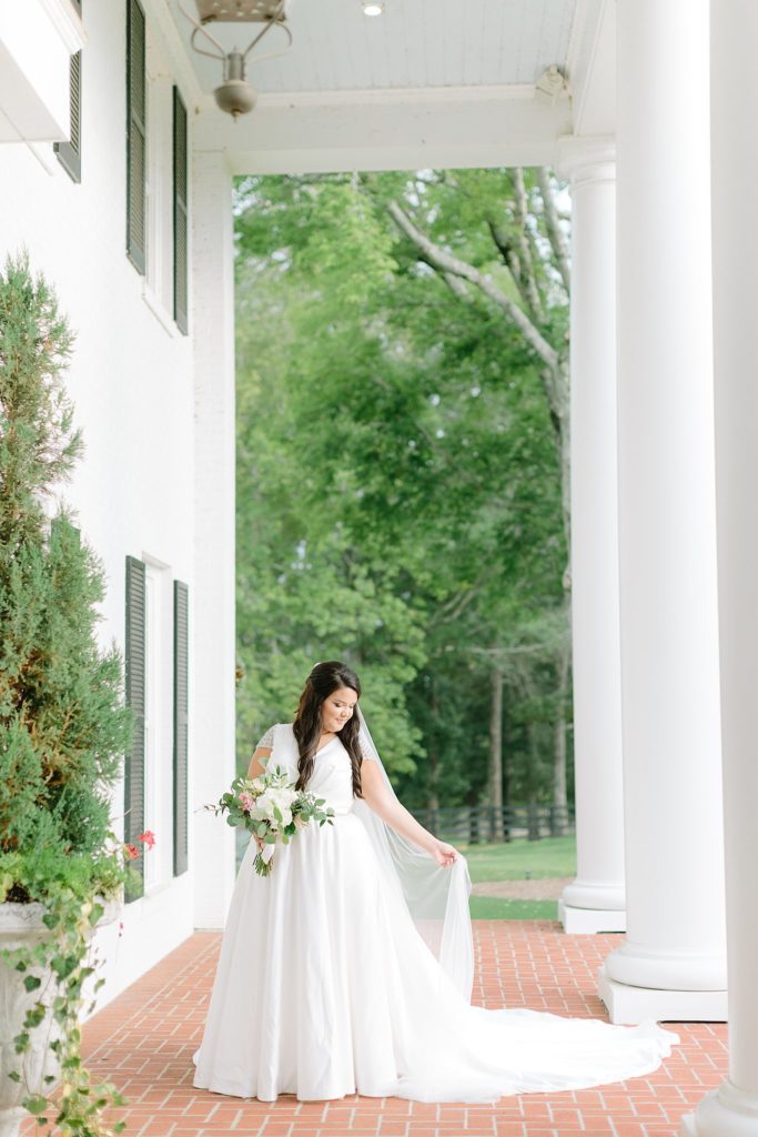 Southern bridal portraits on front porch of white house. 
