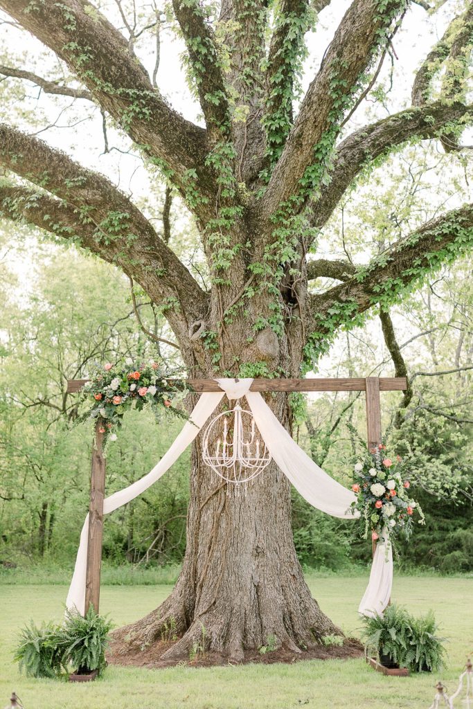 Oak Tree ceremony setup with southern style and pastel florals.